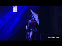 Cute asian girl in national costume is dancing striptease